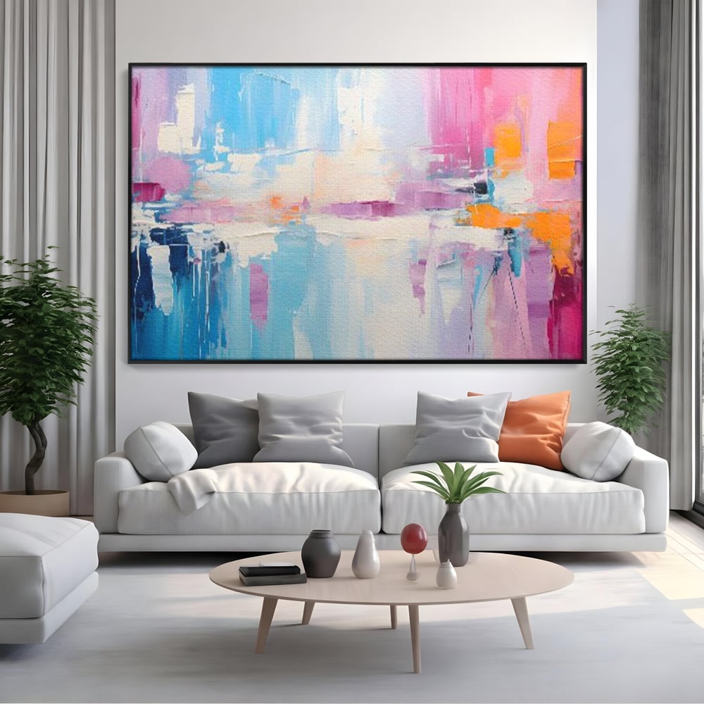 Tablou canvas cu pictura abstracta orizontala in nuante vibrante, in rama de aluminiu negru, pe perete intr-un living